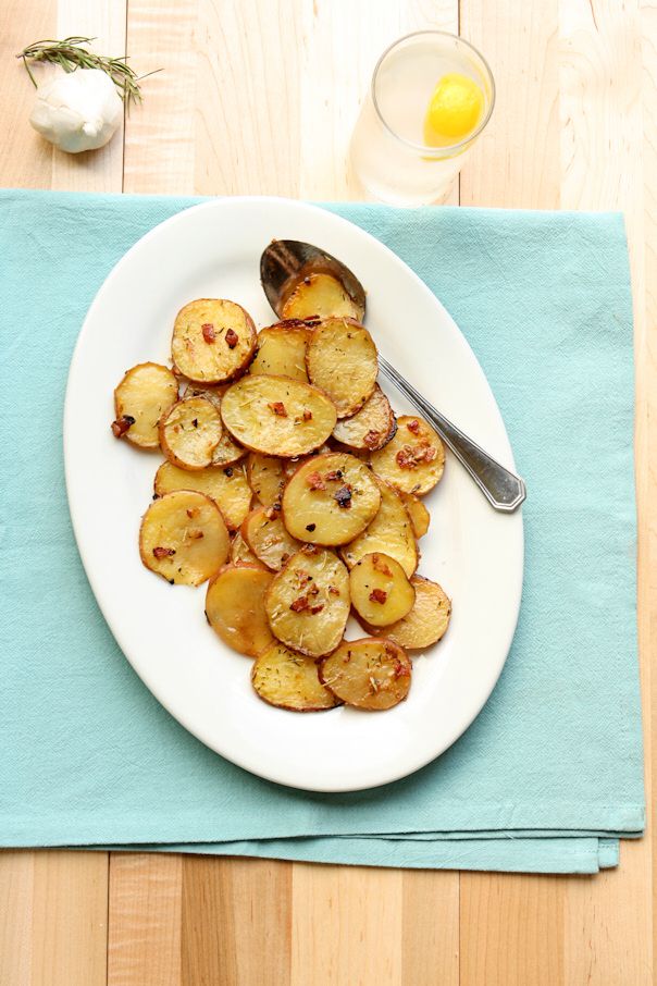 Overhead roasted potatoes on a white platter