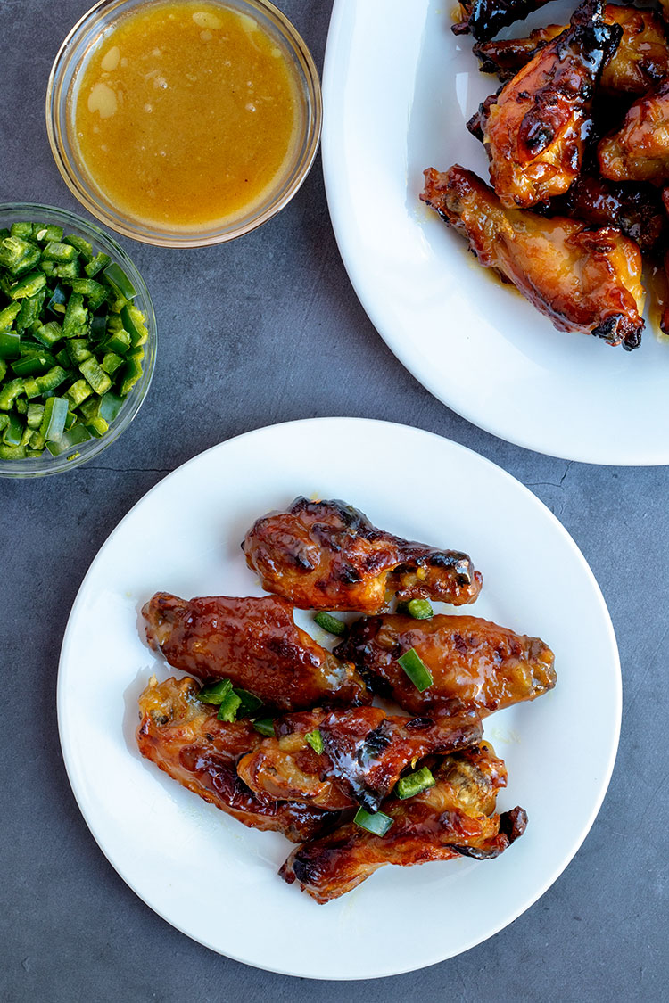 Sweet and Spicy Chicken Wings | Green hot pepper sauce and jalapenos give these wings the spicy, honey gives them the sweet. It's a complementary pairing that will bring you back for more again and again. | www.heavenlyhomecooking.com