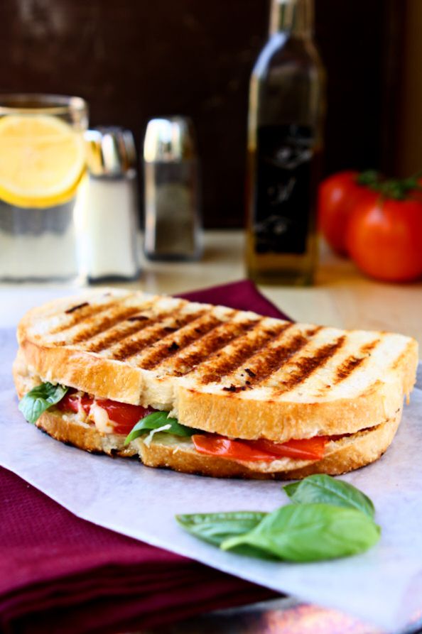 Caprese Panini Sandwich | The classic flavors of a Caprese salad all wrapped up in a crisp panini sandwich and grilled to perfection! | www.heavenlyhomecooking.com