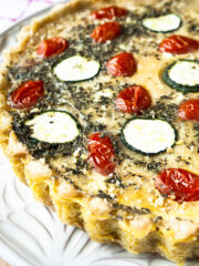 Close up of quiche provencale on a white plate