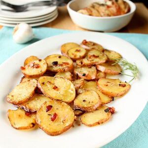 Rosemary oven roasted potatoes on a white platter