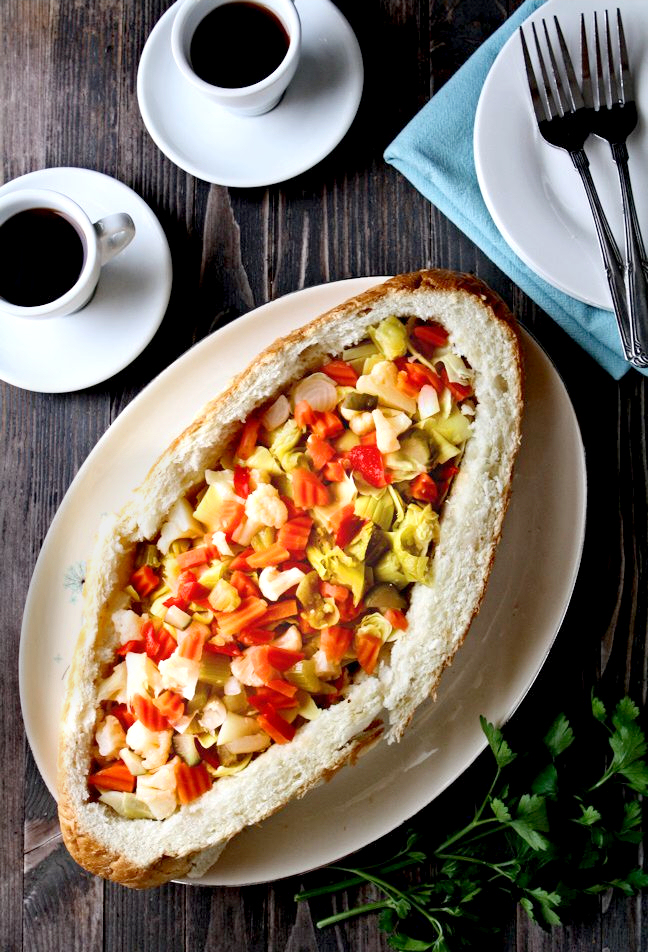 Vegetable Antipasto-Stuffed Bread | This is such a tasty vegetarian antipasto stuffed bread. Plus, you can pull this delicious appetizer together in 30 minutes or less! | heavenlyhomecooking.com