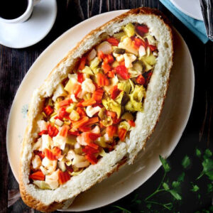 Vegetable Antipasto-Stuffed Bread | Such a tasty vegetarian antipasto stuffed bread. Plus, you can pull this delicious appetizer together in 30 minutes or less! | heavenlyhomecooking.com