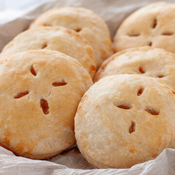 Piña Colada Hand Pies | Think sun, sand and relaxation with the tropical flavors of pineapple, coconut and rum. Enjoy! | www.heavenlyhomecooking.com