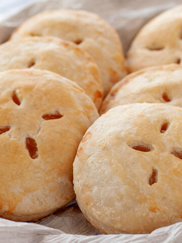 Pi&ntilde;a Colada Hand Pies | Think sun, sand and relaxation with the tropical flavors of pineapple, coconut and rum. Enjoy! | www.heavenlyhomecooking.com