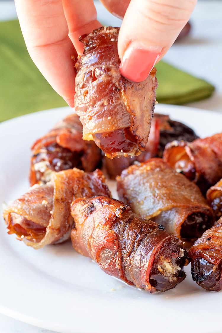 Bacon-Wrapped Dates with Herbed Goat Cheese | These are some of the tastiest appetizers you will ever eat. So easy to make too! | www.heavenlyhomecooking.com