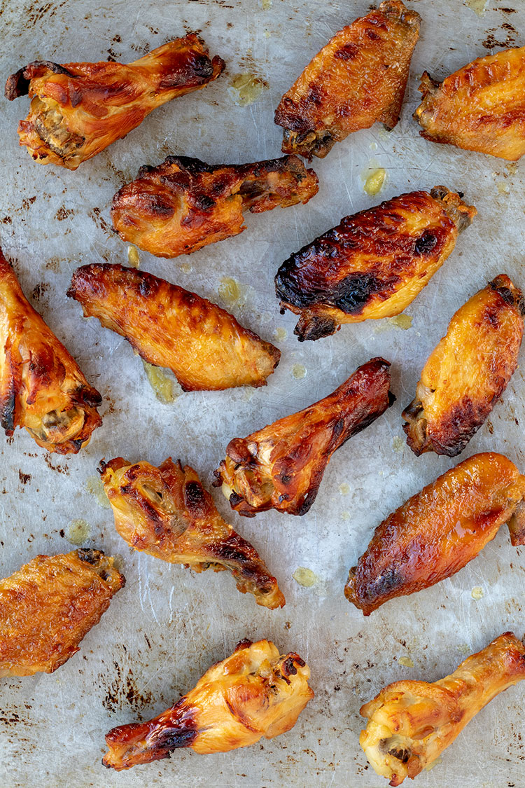 Sweet and Spicy Chicken Wings | Green hot pepper sauce and jalapenos give these wings the spicy, honey gives them the sweet. It's a complementary pairing that will bring you back for more again and again. | www.heavenlyhomecooking.com