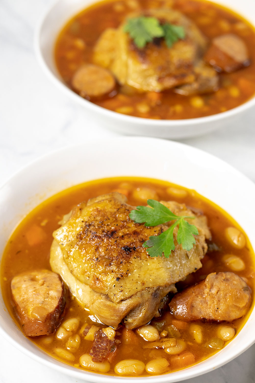 Close up view of stew in two white bowls