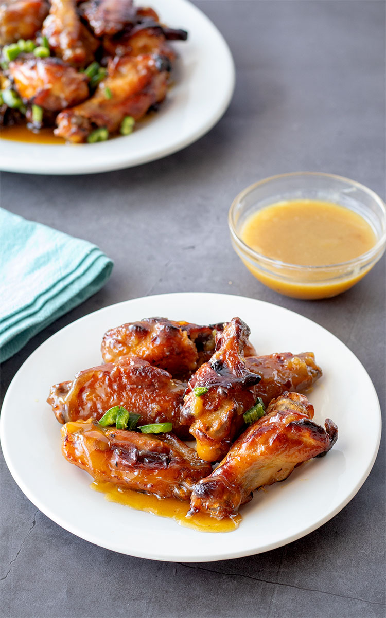 Sweet and Spicy Chicken Wings | Green hot pepper sauce and jalapenos give these wings the spicy, honey gives them the sweet. It's a complementary pairing that will bring you back for more again and again. | www.heavenlyhomecooking.com