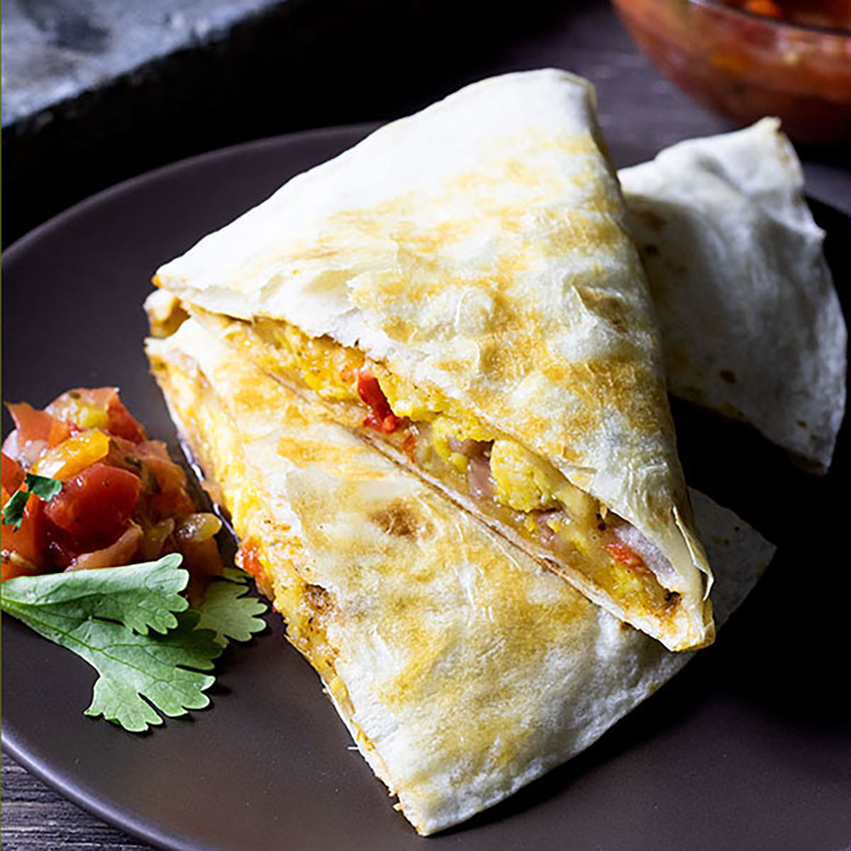 Breakfast quesadilla on a brown plate