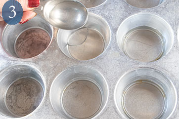 Adding tablespoon of water to each well of a mufin tin