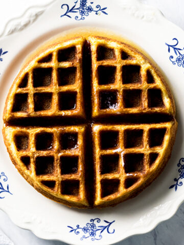 Snickerdoodle waffle sitting on a white and blue floral plate