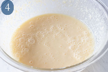 Glass bowl filled with buttermilk waffle batter