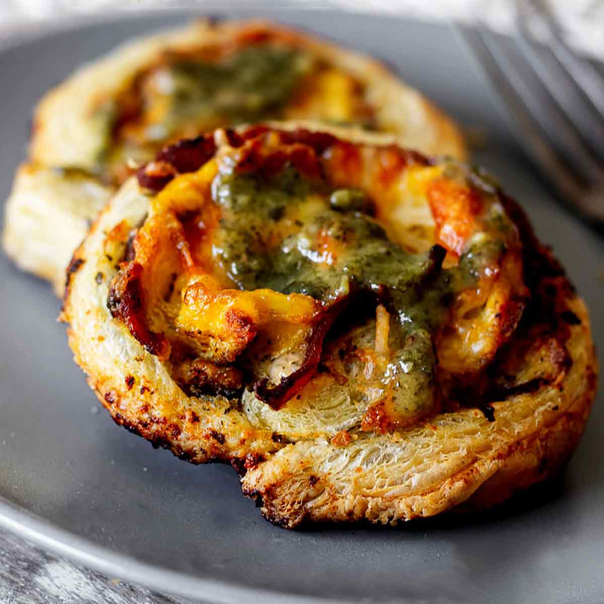 Breakfast pinwheels on a grey plate