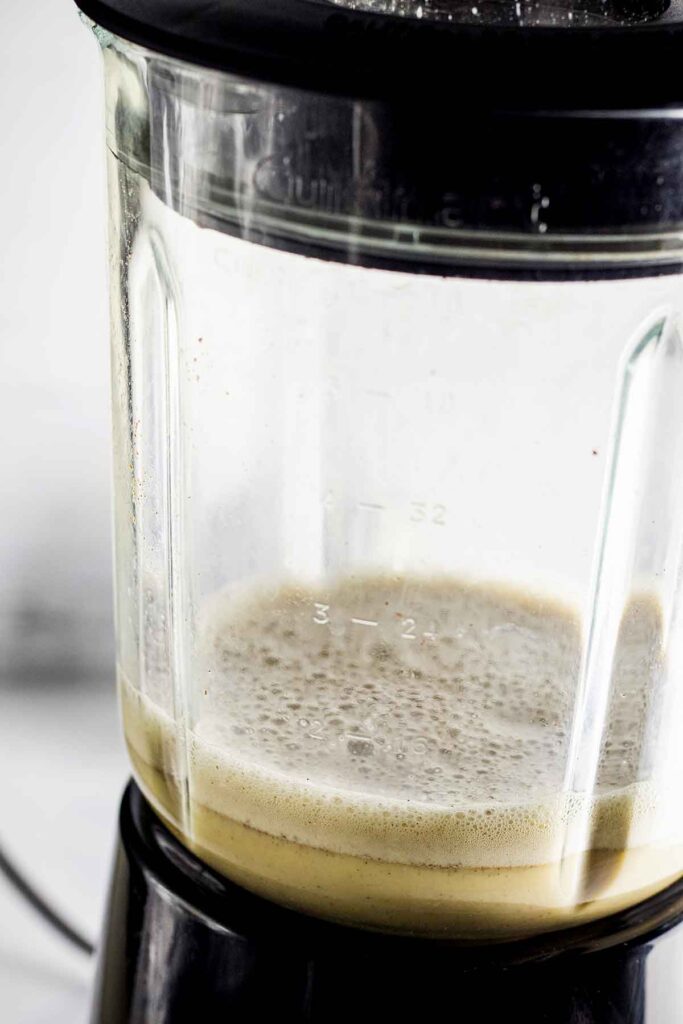 Frothy egg mixture in a blender.