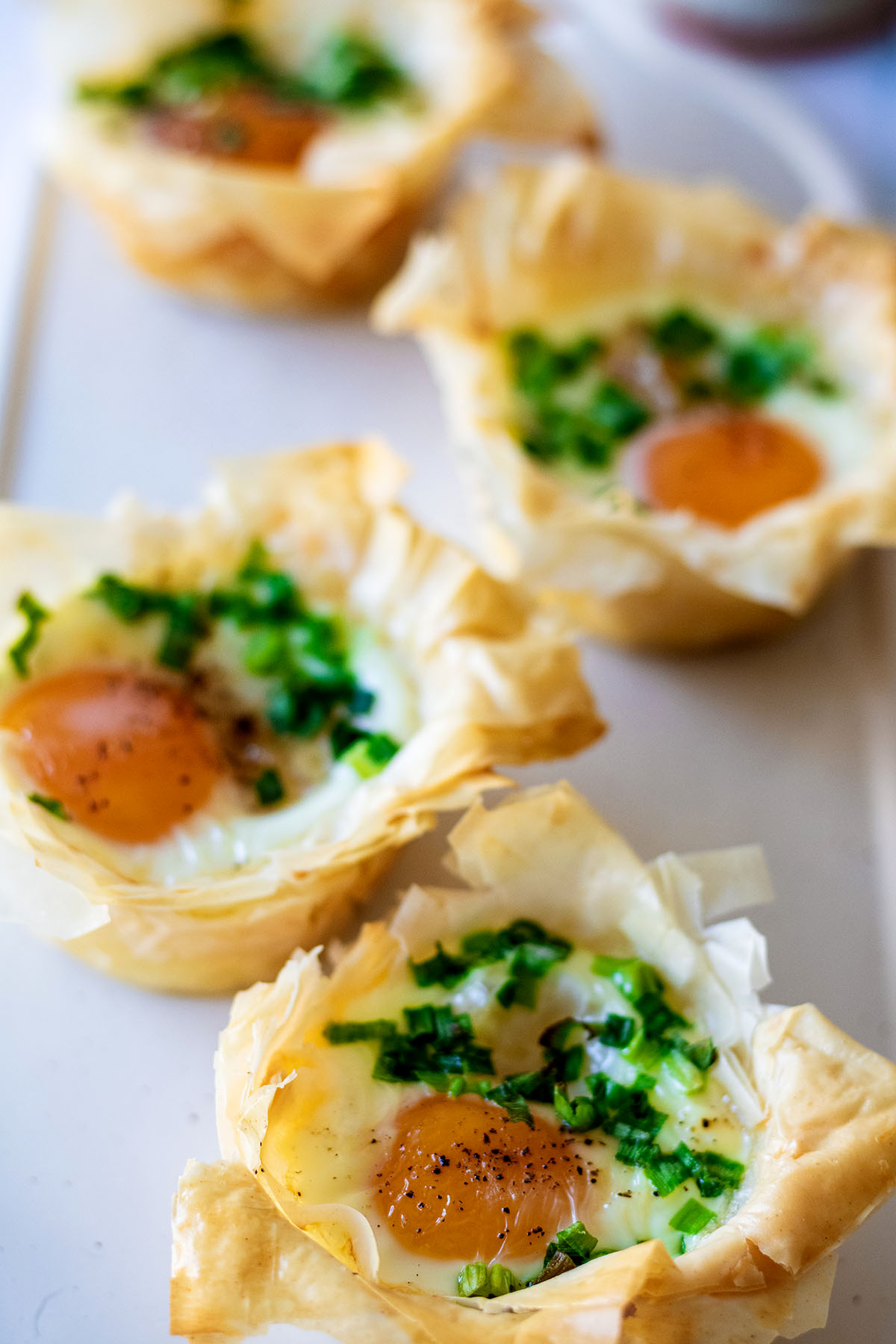 Phyllo breakfast cups on a white tray