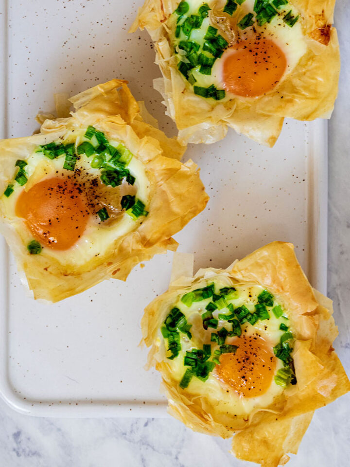 Overhead view of phyllo breakfast cups on a white tray
