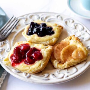 Breakfast pastries on a white plate with a blue napkin