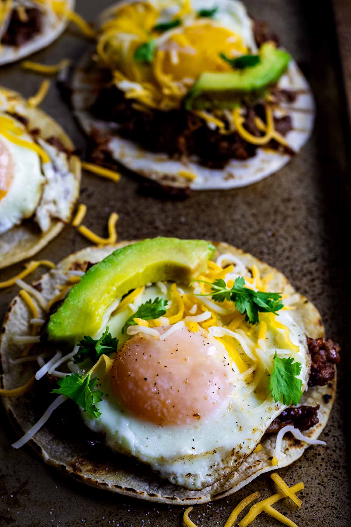 Finished breakfast street tacos on a cookie sheet