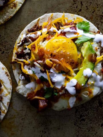 Breakfast street tacos on a baking sheet