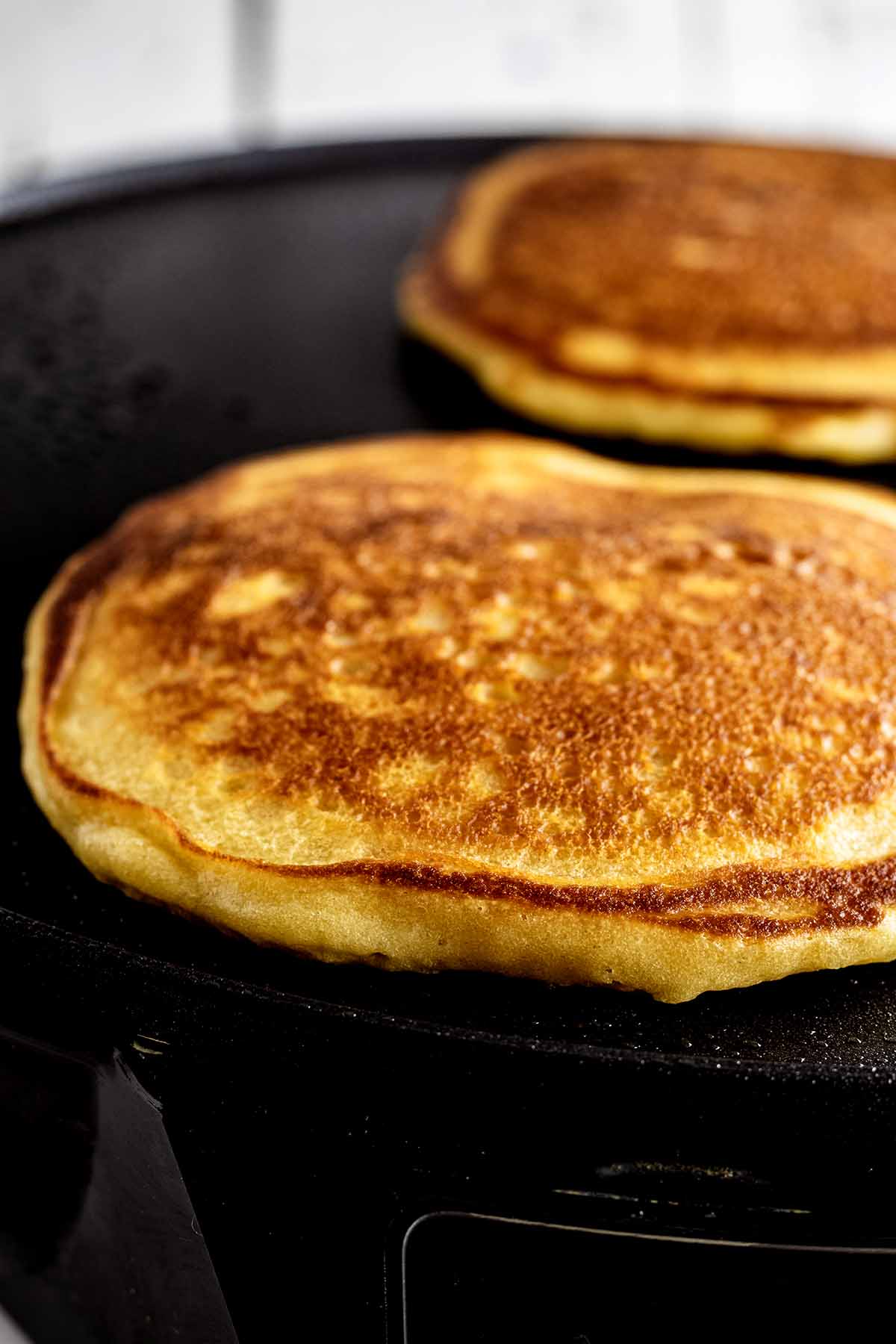 Cooked butterscotch pancakes on a griddle
