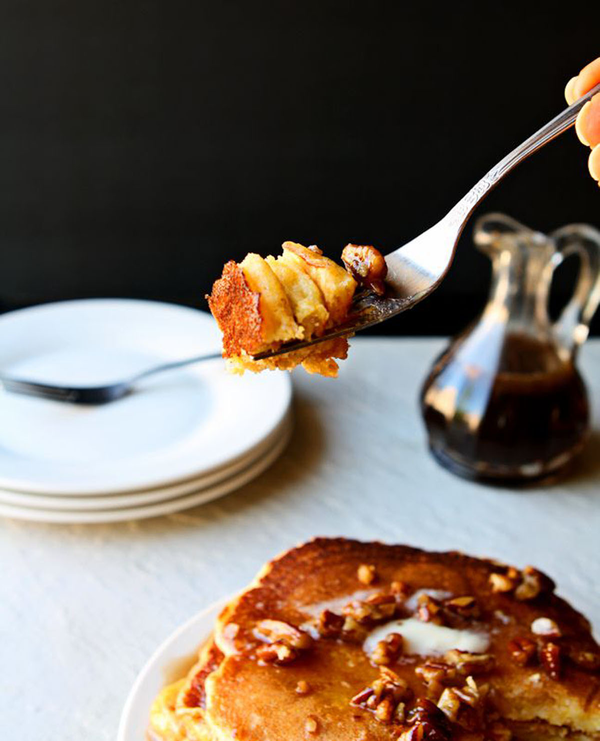 Bite of cornbread pancakes on a fork