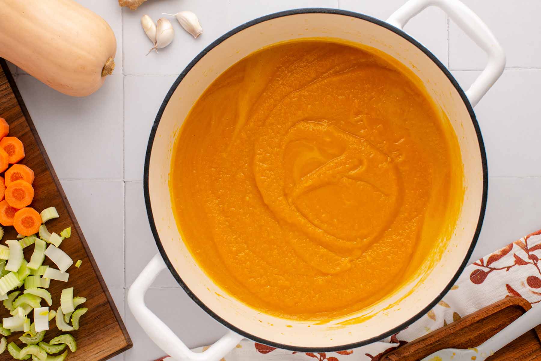 Cooked creamy butternut squash soup in a Dutch oven.