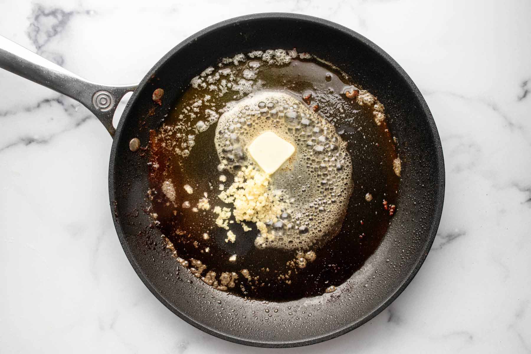 Minced garlic and butter in a skillet.