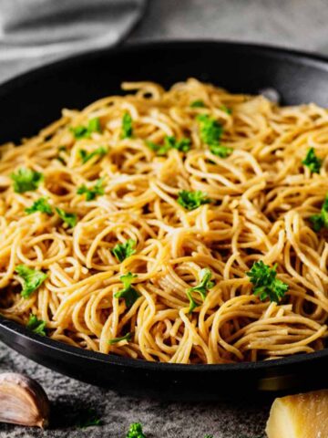 Close up of Parmesan butter noodles in a skillet.