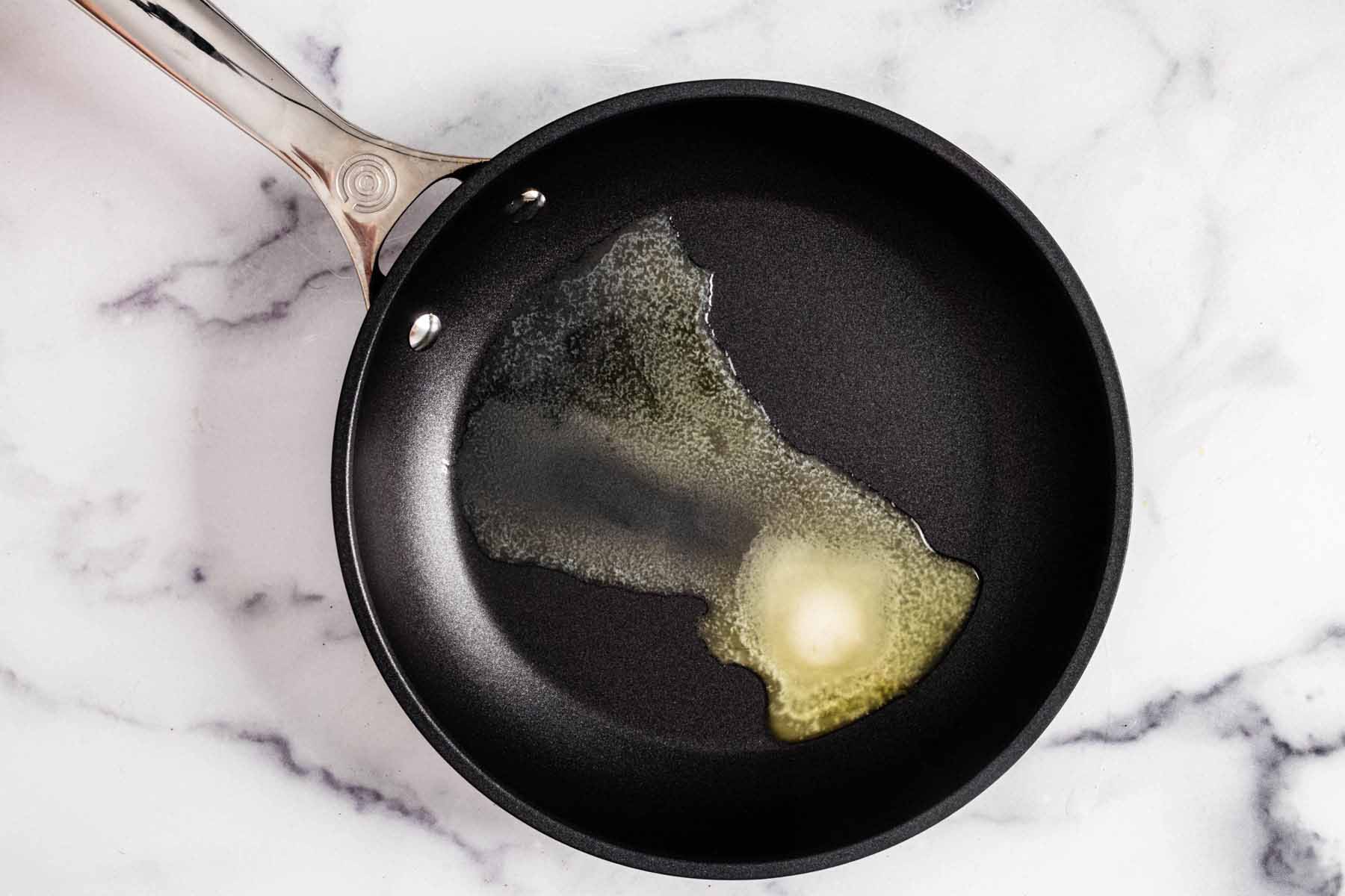 Butter melting in a small skillet.