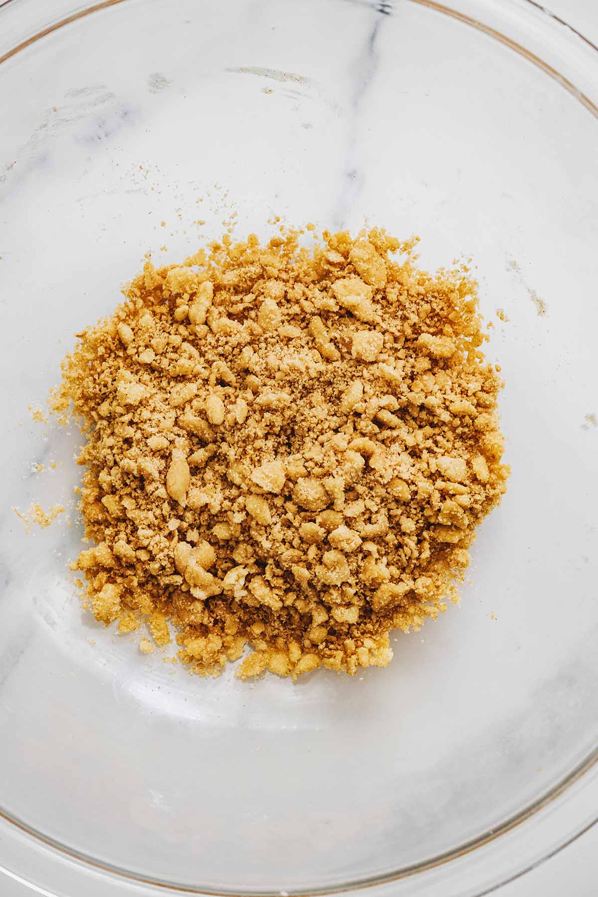 Ginger crumb topping mixture in a glass bowl