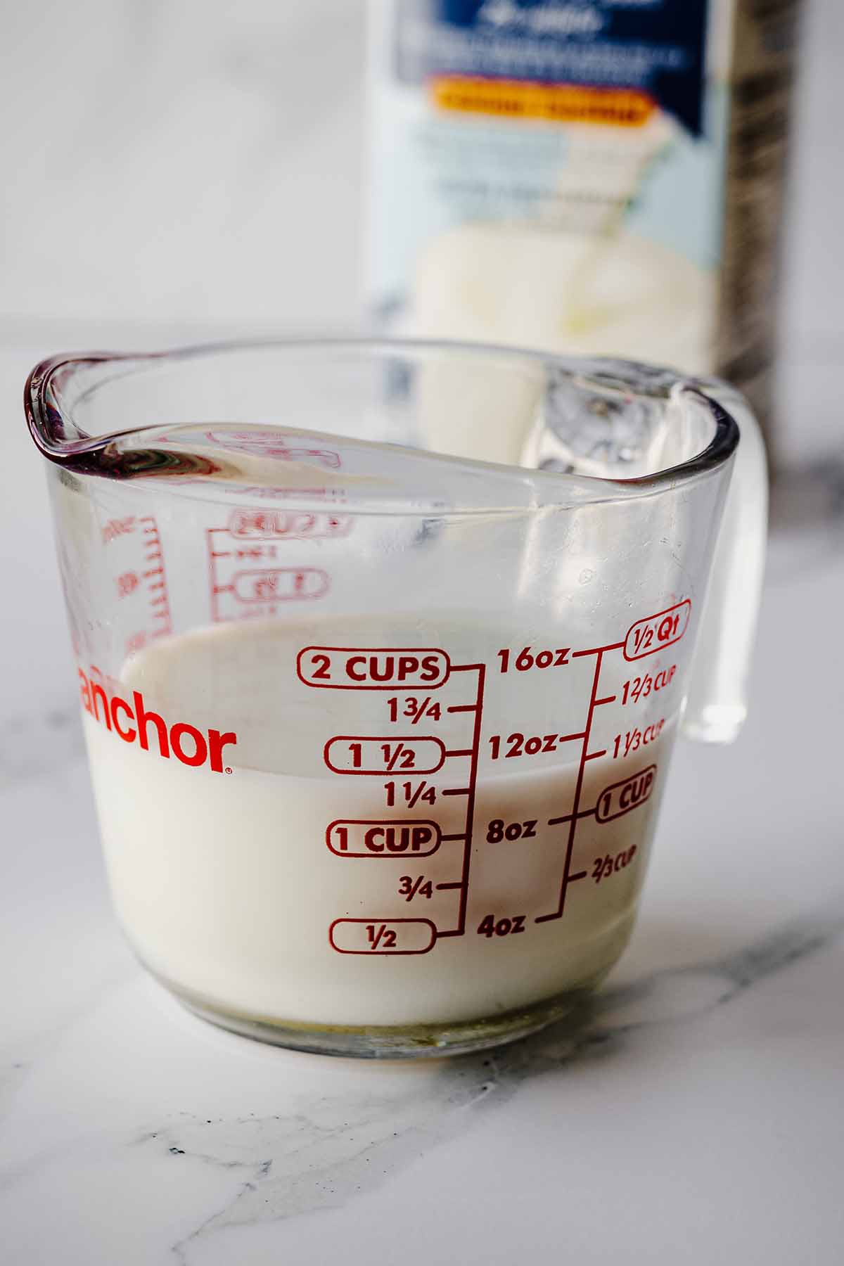 Milk in a liquid measuring cup