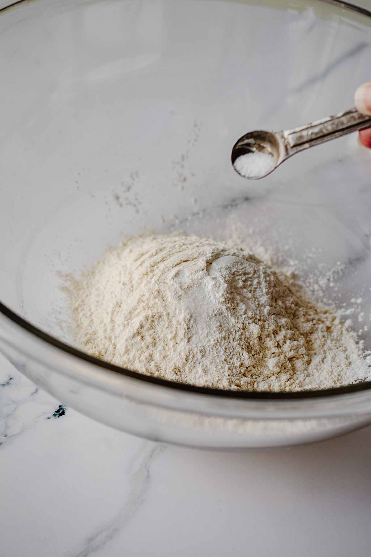 Salt being added to glass bowl