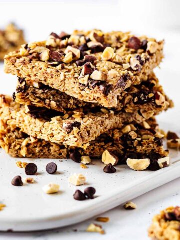 Stack of granola bars on a white platter