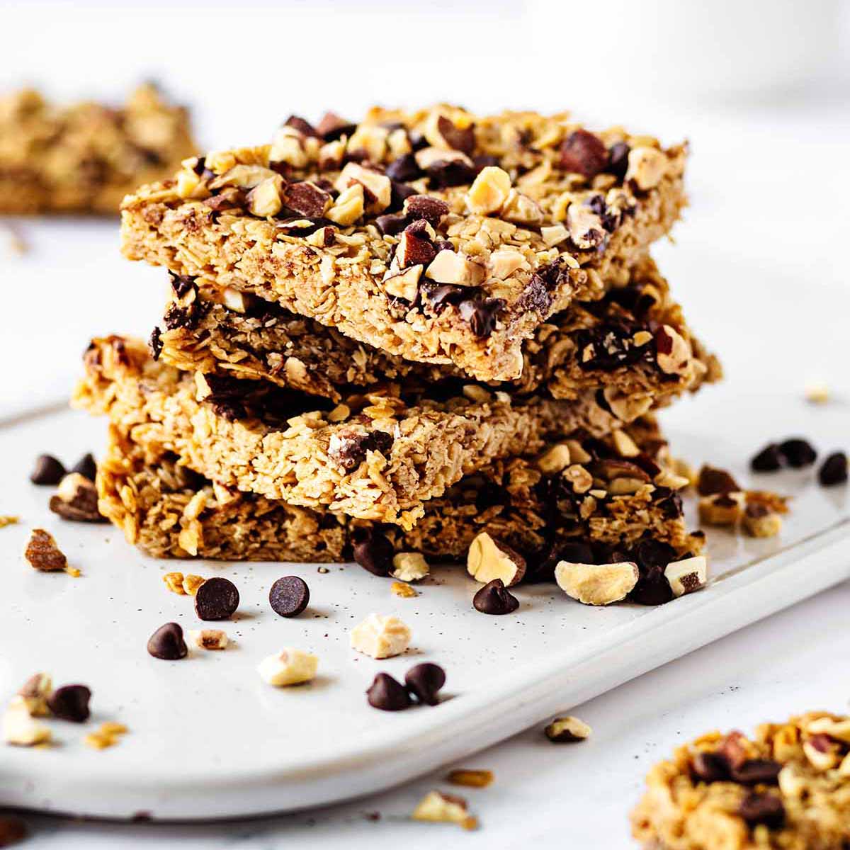 Stack of granola bars on a white platter