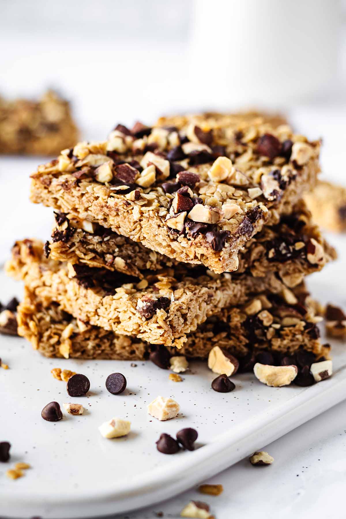 Close up of stack of granola bars on a white platter