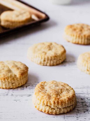 Multiple biscuits on a white weathered table
