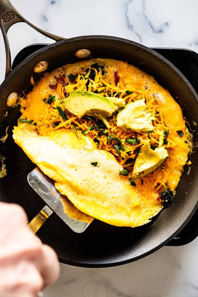 https://heavenlyhomecooking.com/wp-content/uploads/2021/04/Keto-Omelette-Recipe-Step-12-683x1024.jpg