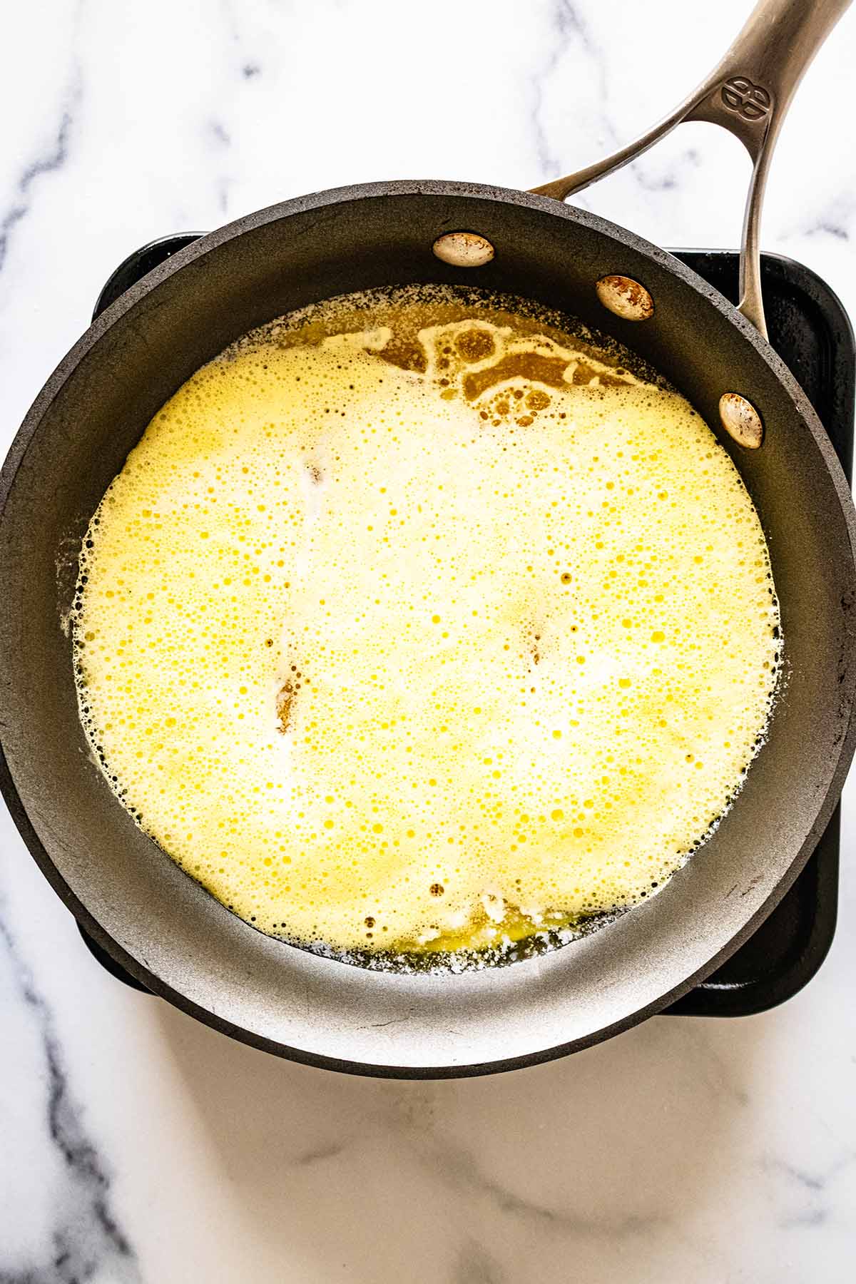 Beaten eggs in a skillet