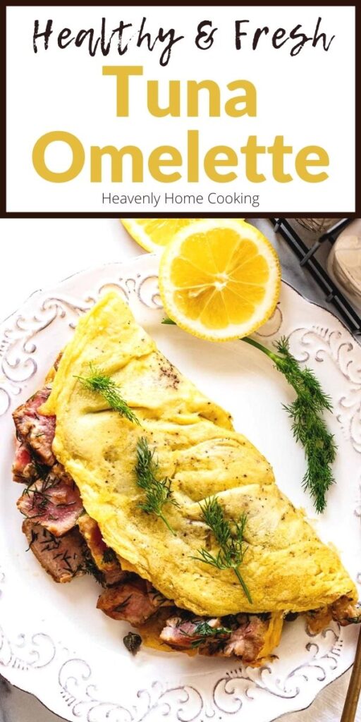 Overhead view of tuna omelette with text overlay on a white plate with a sprig of dill and sliced lemons and a gold fork