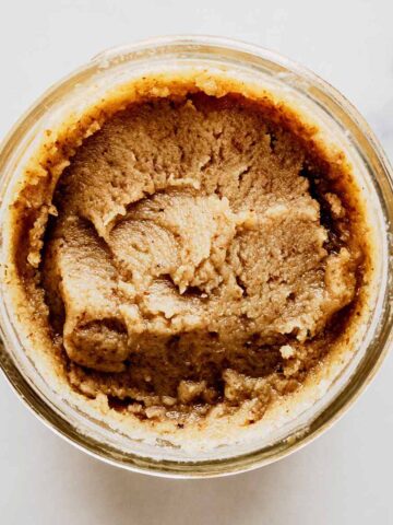 Overhead view of walnut butter in a jar