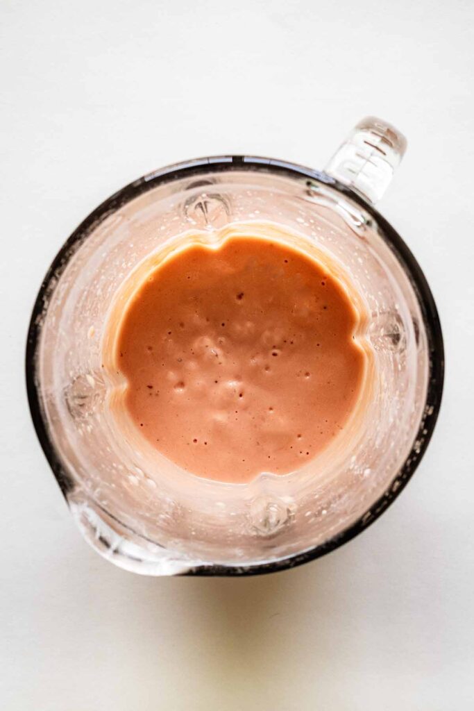 Overhead view of blended smoothie in a blender