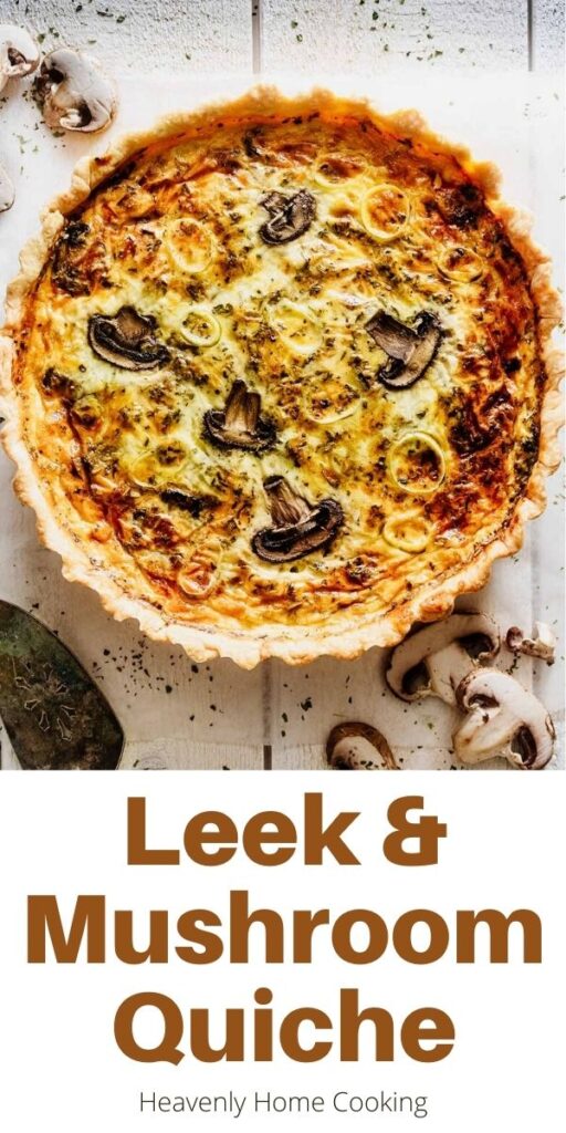 Overhead view of whole quiche on a white wood background with mushrooms and a serving spatula with text overlay "Leek & Mushroom Quiche"