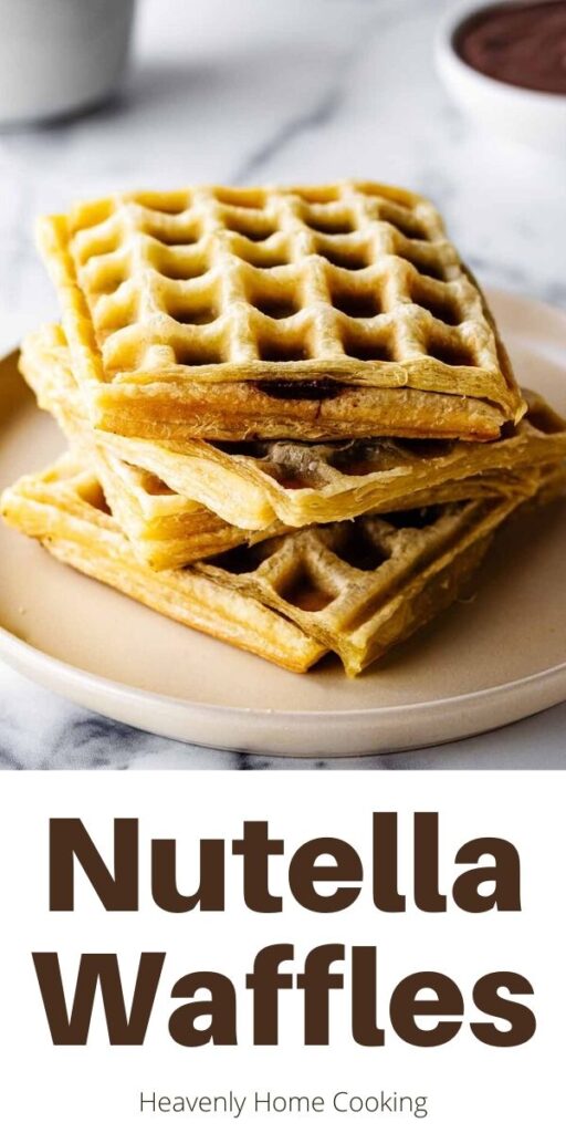 Stack of Nutella waffles on a creamy white plate a bowl of Nutella is in the background