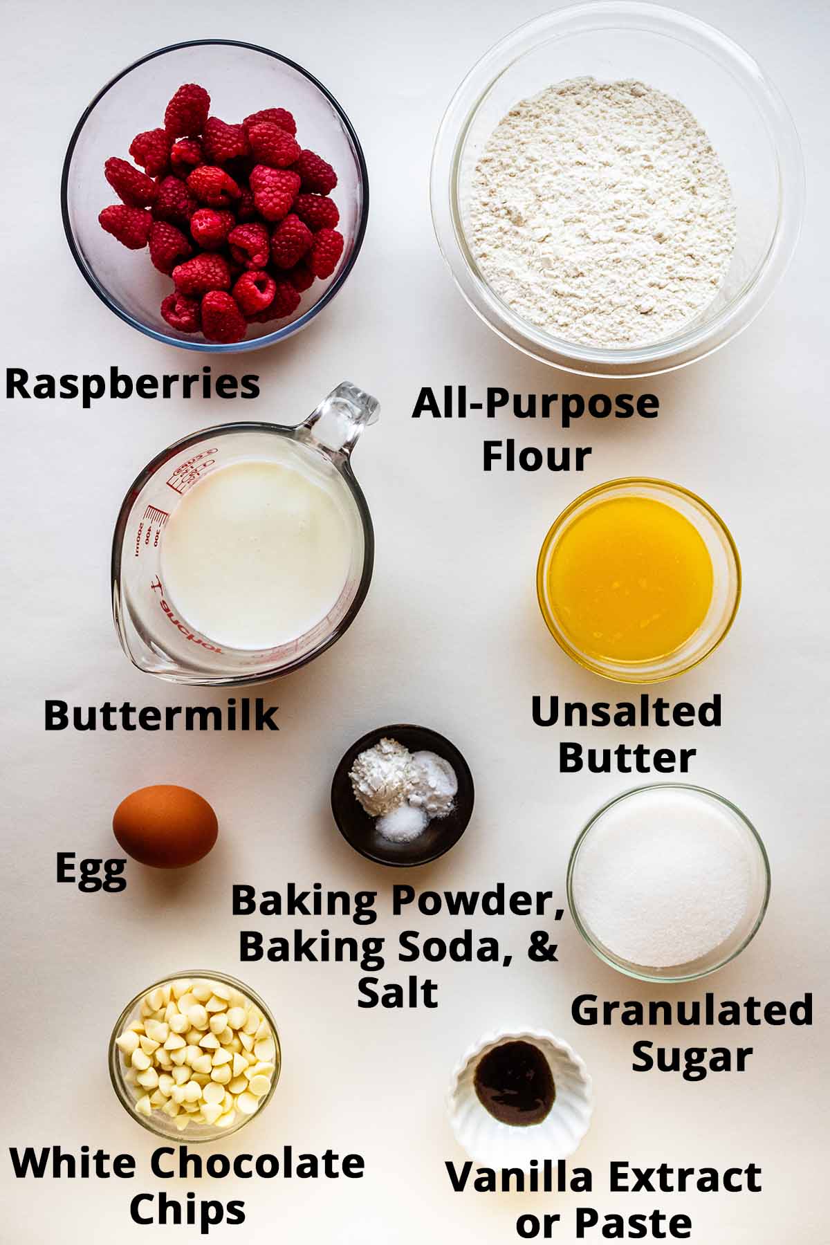Overhead view of raspberry and white chocolate muffin ingredients