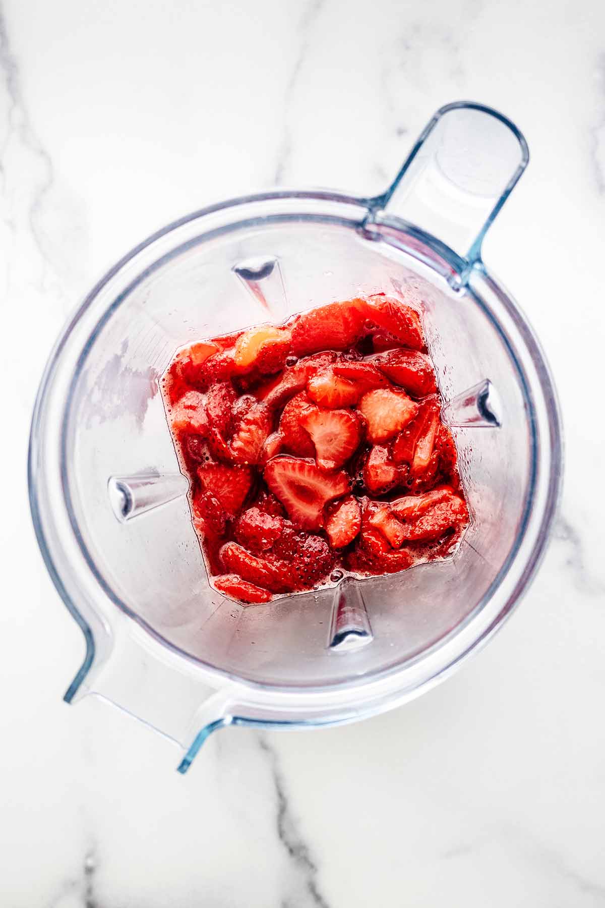 Overhead view of cooked compote in a blender