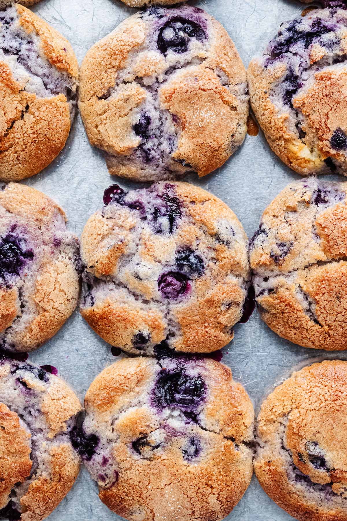 Overhead closeup of eggless blueberry muffins in a muffin pan