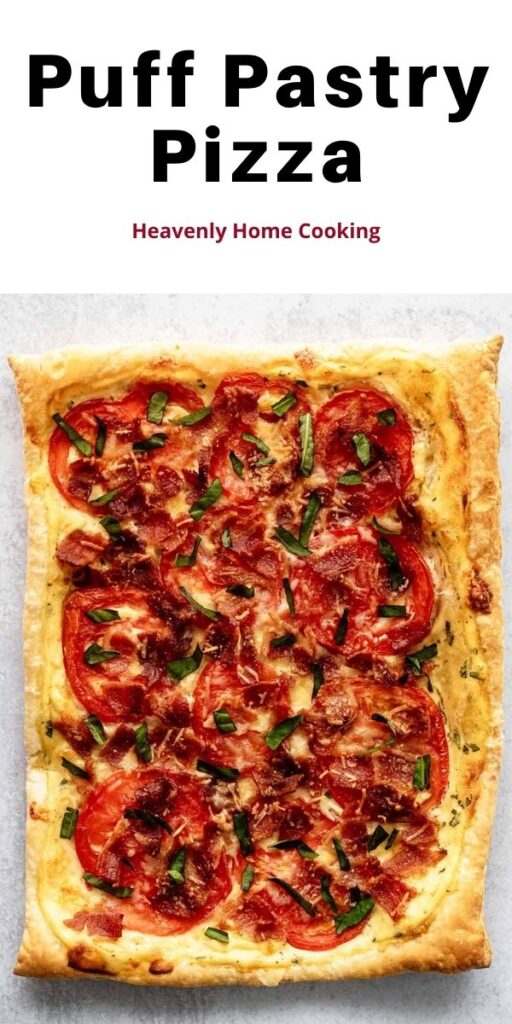 Whole puff pastry pizza on a concrete countertop.