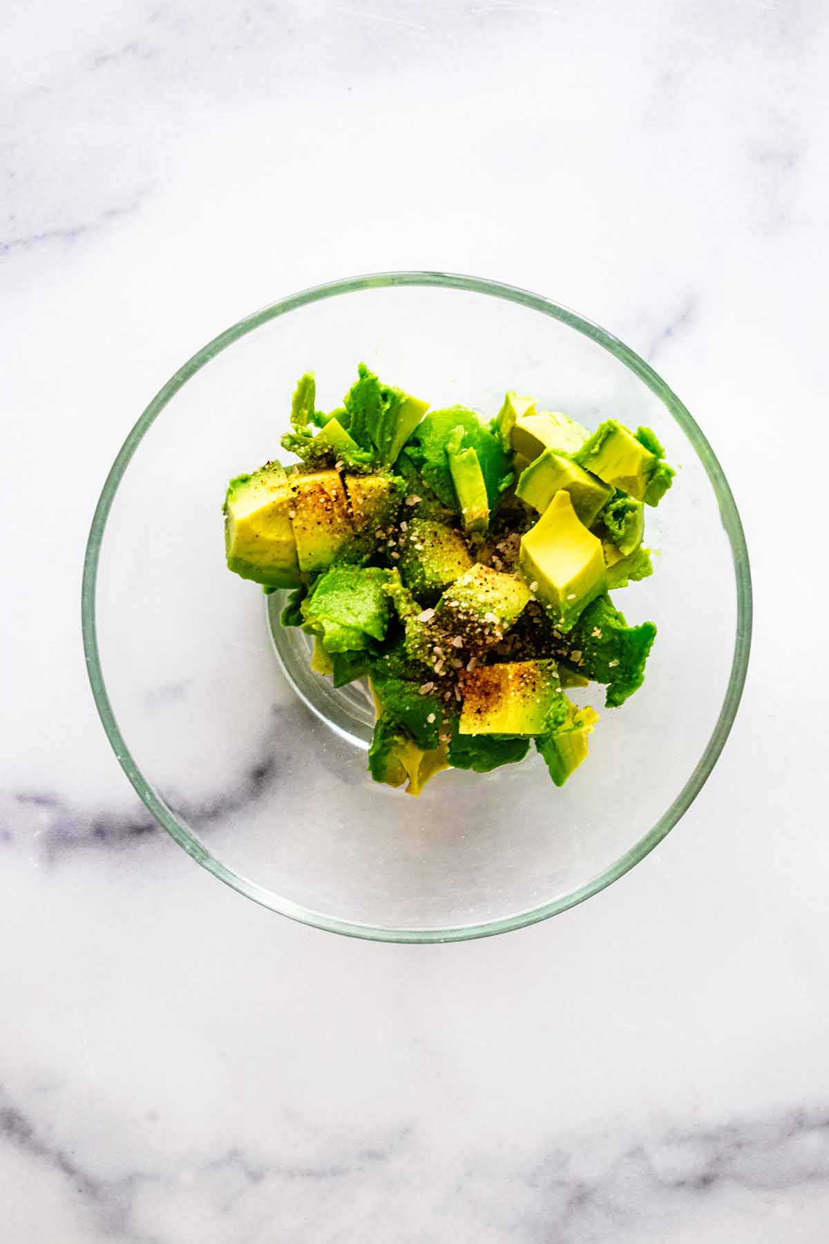 Chopped avocado in a small glass bowl