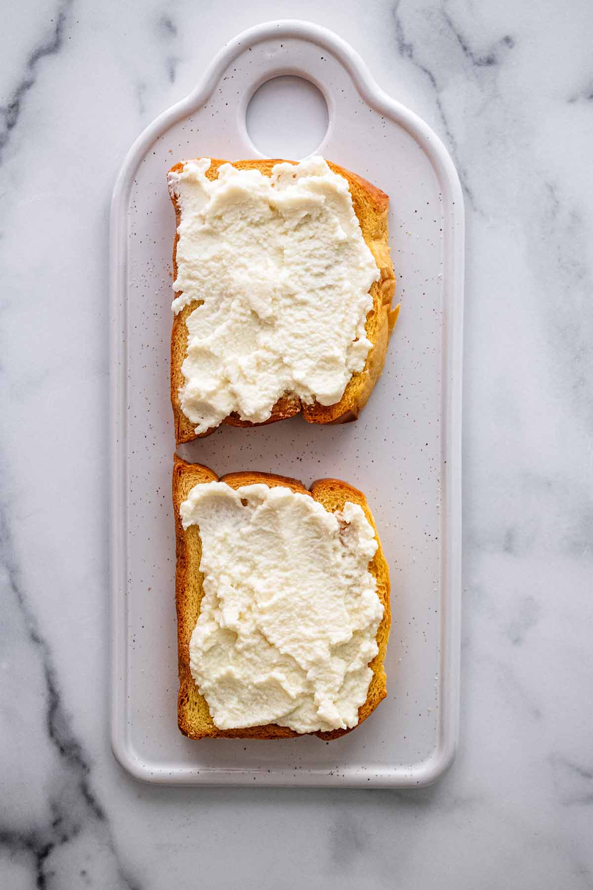 Brioche toast topped with whipped ricotta.